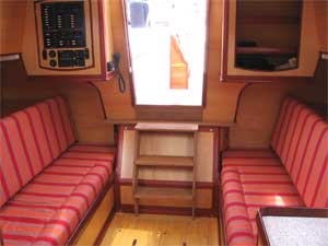 Erica's interior. The seatbacks fold away to reveal wide berths.